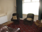 More orange carpet - living room. With my grandparent's chairs (they died 25 years ago...)